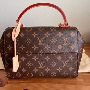 Authentic Louis Vuitton Clunny BB with pink leather strap, monogram canvas